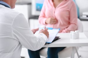 pregnant woman consulting with medical professional