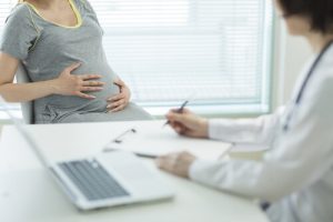 pregnant woman at the consultation with doctor