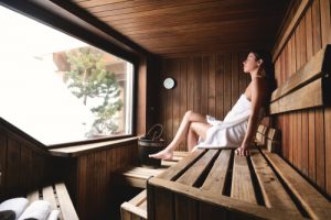 woman sitting in sauna