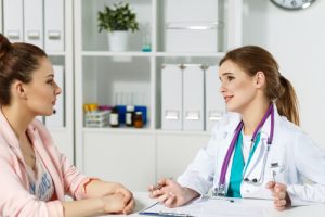 woman consulting with medical professional